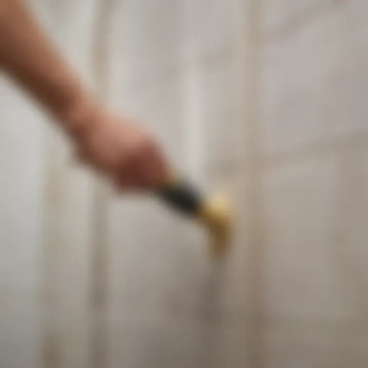 A professional applying latex caulk to a shower edge