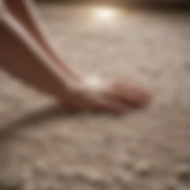 Close-up of a hand applying cleaning solution to a delicate rug