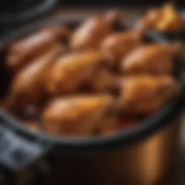 An air fryer showcasing chicken wings cooking inside