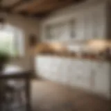 Elegant farmhouse kitchen showcasing distressed white cabinets