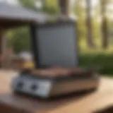 A propane BBQ griddle showcasing its sleek design and cooking surface