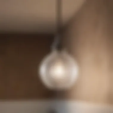 Charming frosted glass pendant lights adding warmth to a bathroom.