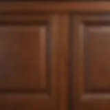 Close-up of freshly stained kitchen cabinet wood showing rich colors and textures.