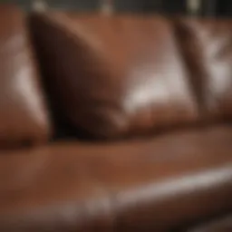 Close-up of a leather couch showing a rip