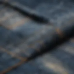 Detailed view of oil stains on denim fabric highlighting the texture