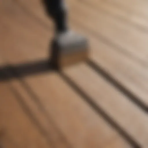 Close-up of a wooden deck surface being sanded